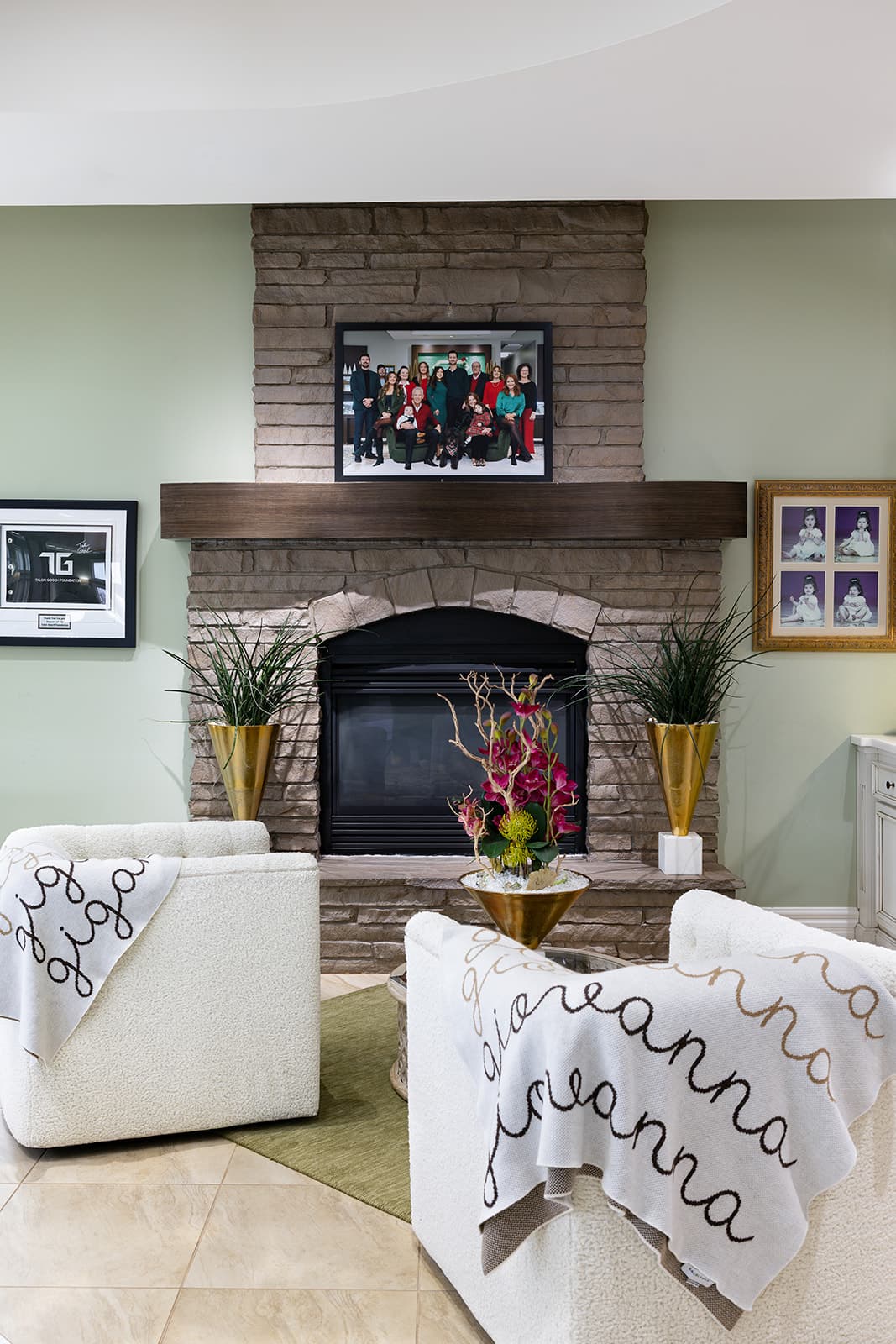 The Giganti family portrait above the stone fireplace at the Springfield, IL showroom